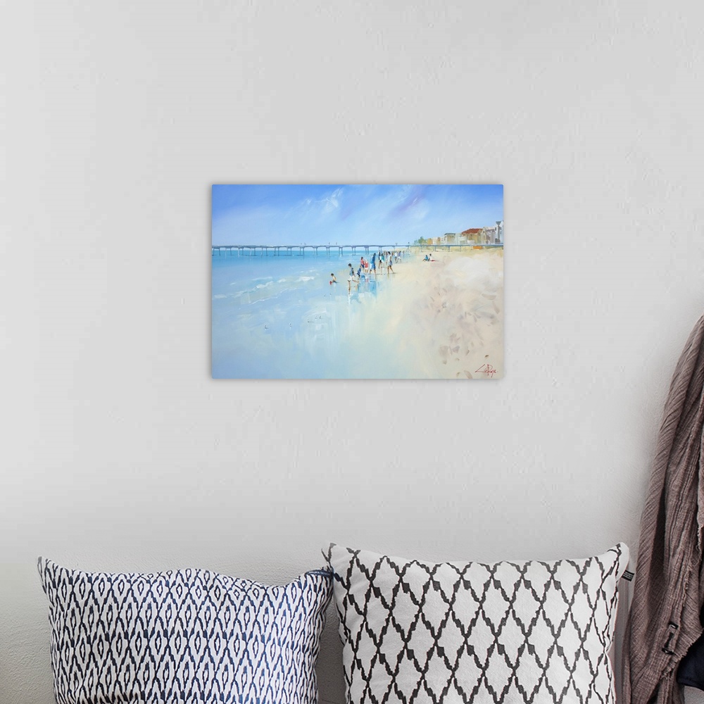 A bohemian room featuring Painting of people playing in the ocean at low tide.