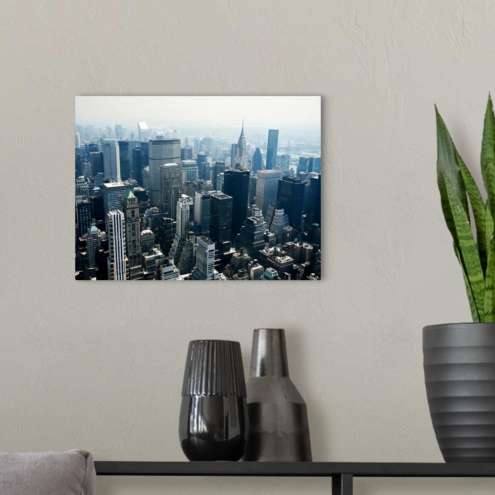 A modern room featuring City skyline of New York with the Art Deco-style skyscraper, the Chrysler Building.