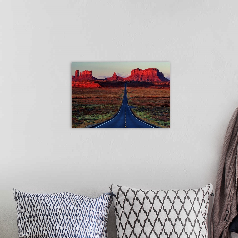 A bohemian room featuring Photograph of a road dividing the Arizona and Utah deserts.