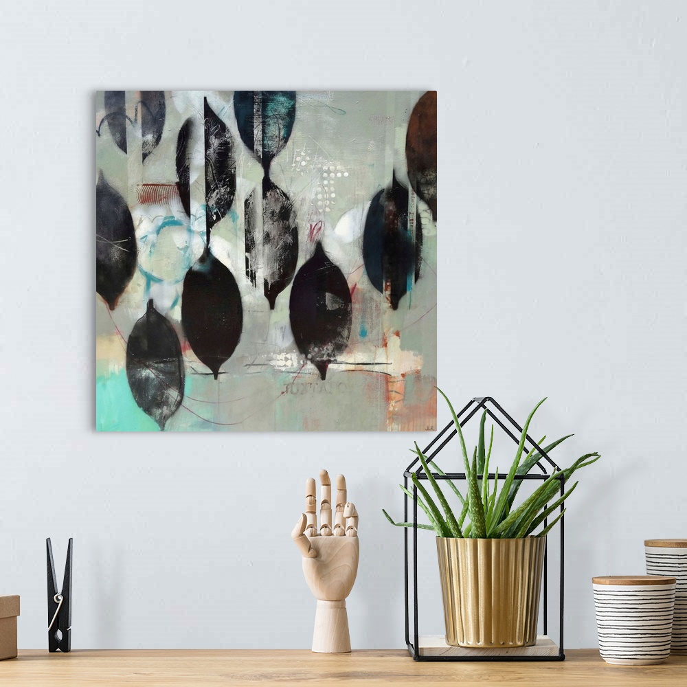 A bohemian room featuring A contemporary abstract painting using mostly gray for the background with black organic shapes i...