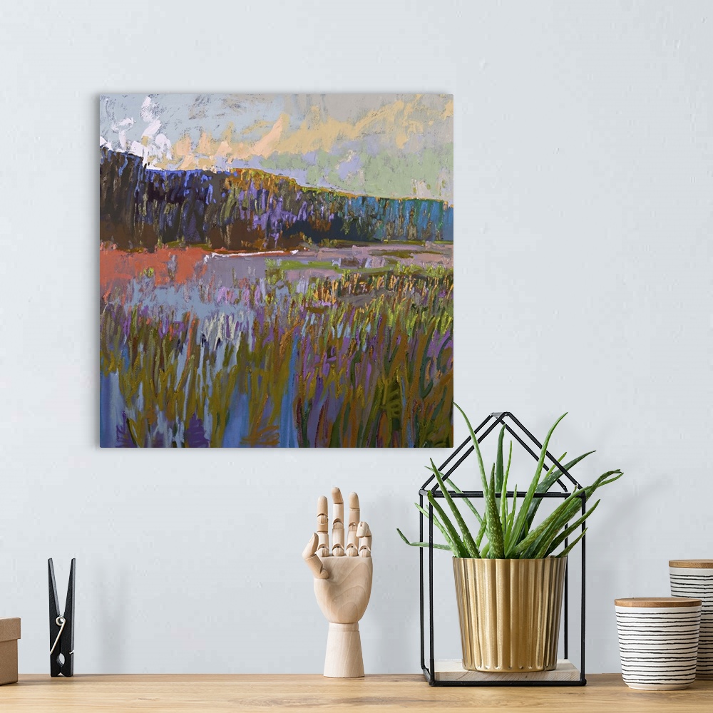 A bohemian room featuring Contemporary landscape painting of a grassy field at sunset.