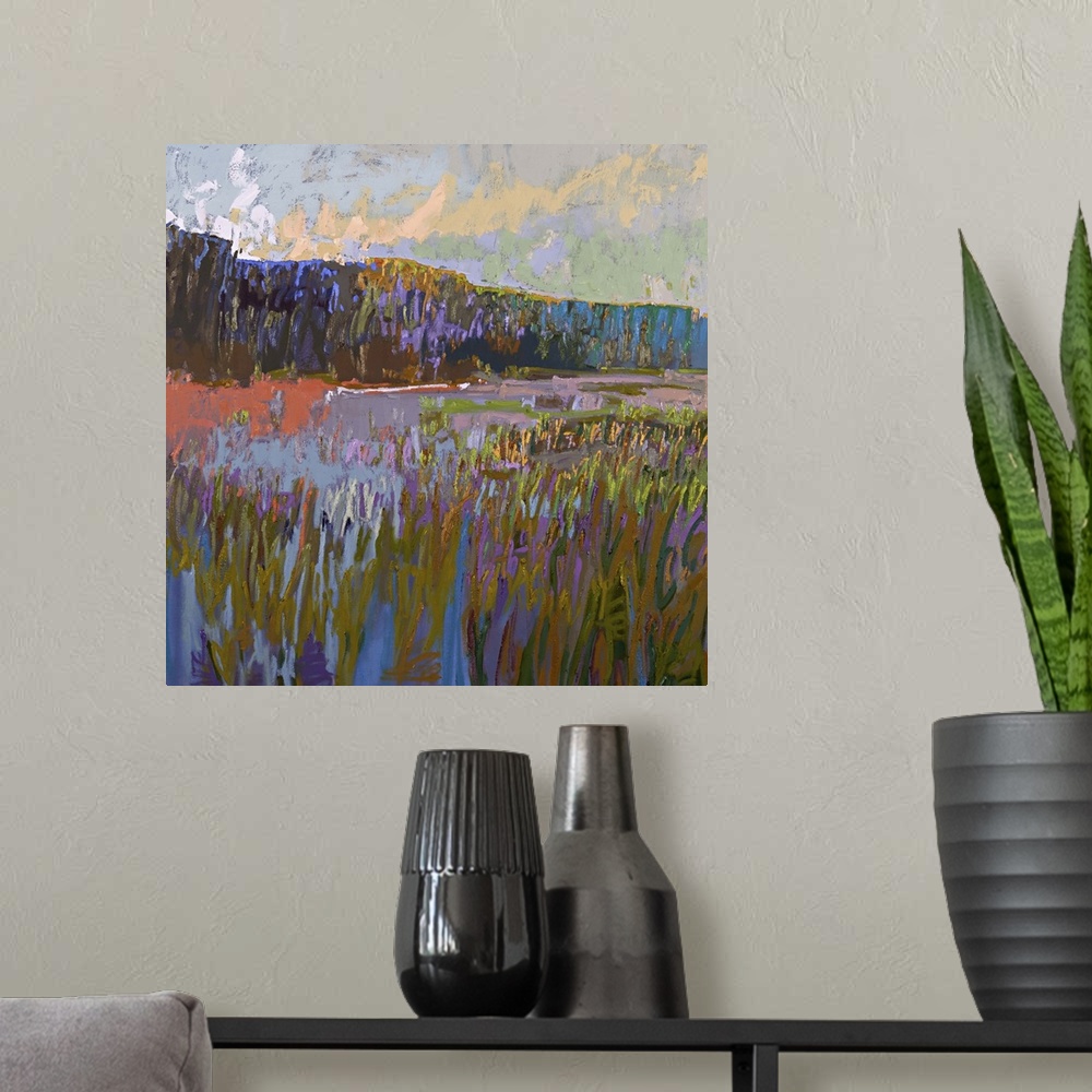 A modern room featuring Contemporary landscape painting of a grassy field at sunset.