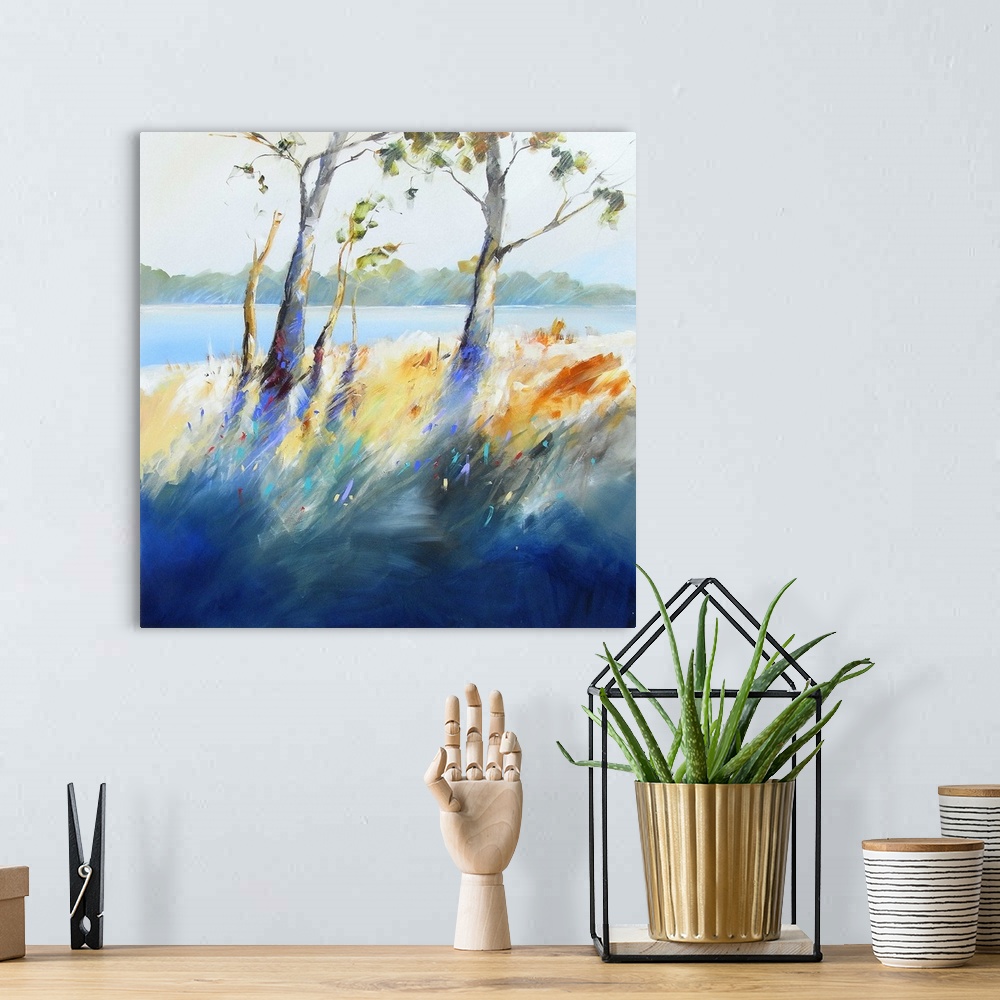 A bohemian room featuring Contemporary painting of trees and grass growing next to a river.
