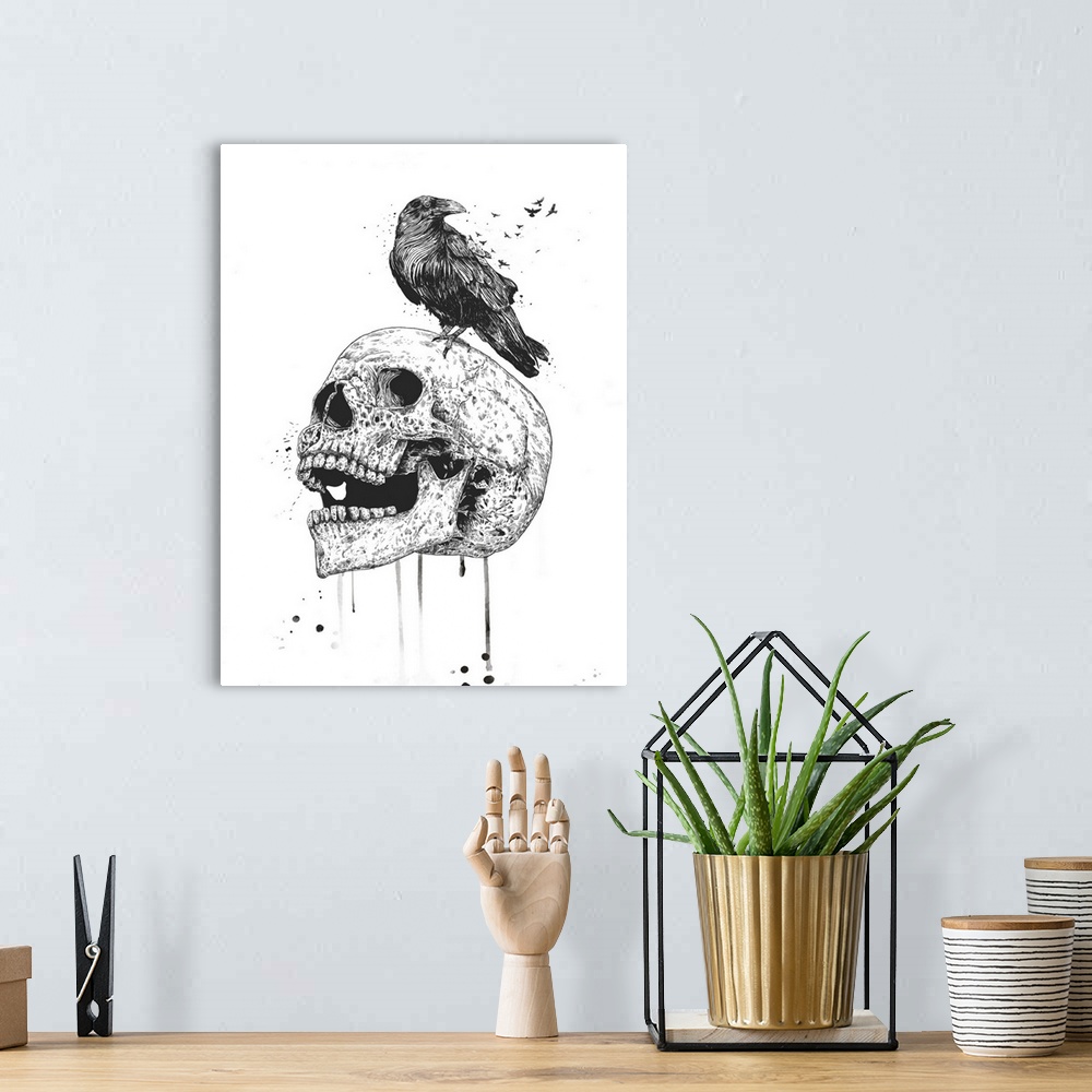 A bohemian room featuring Surrealistic illustration of a raven sitting atop a skull.
