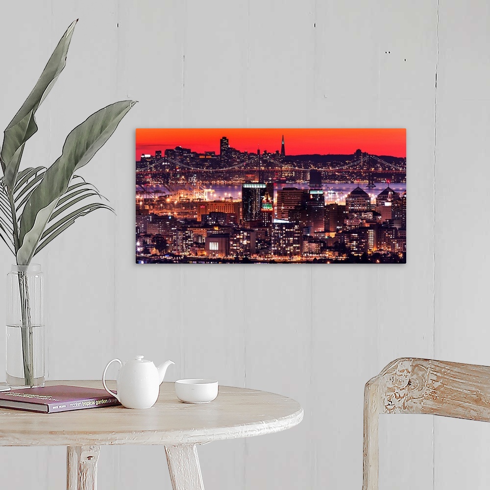 A farmhouse room featuring A photograph of a vibrant neon lighted cityscape at sunset.