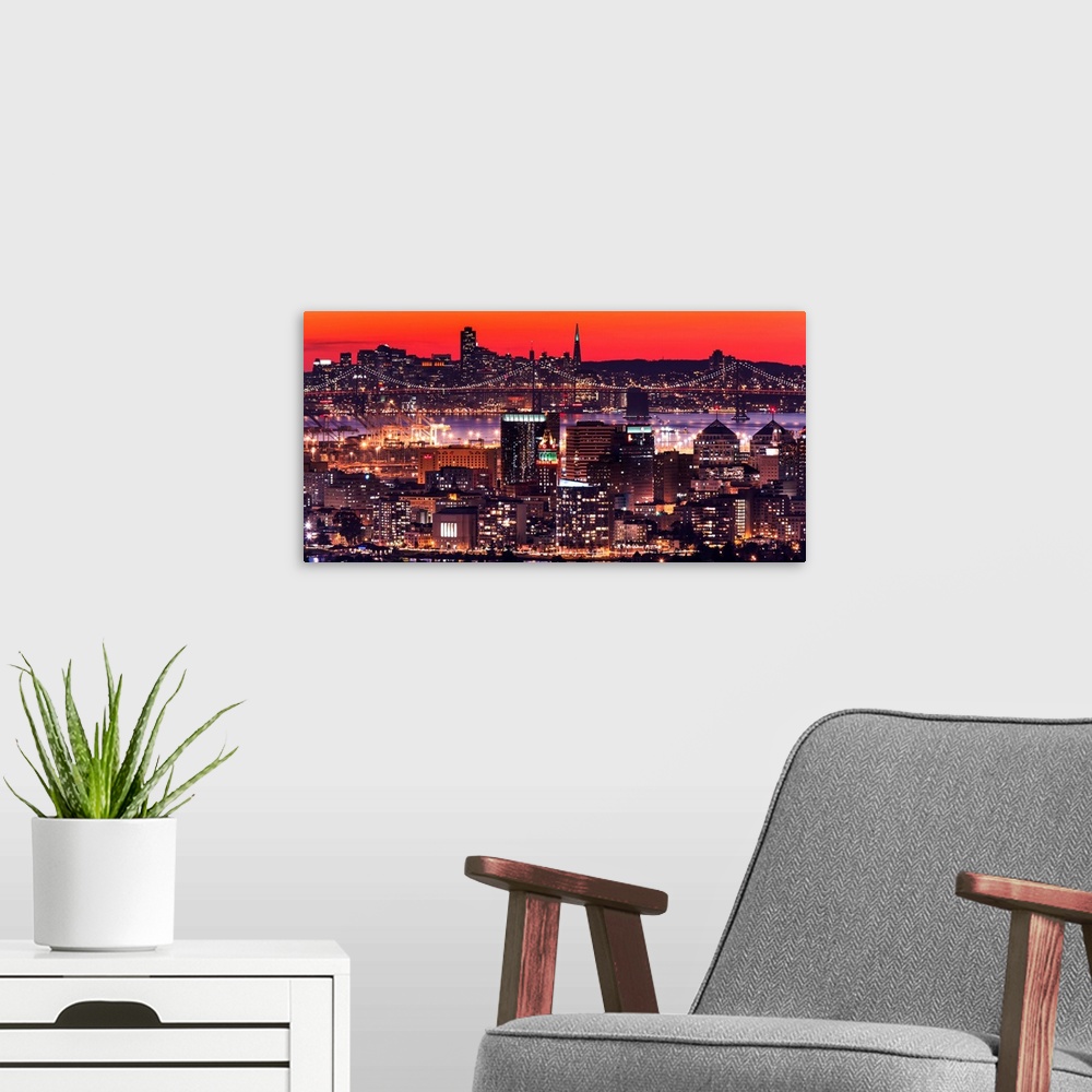 A modern room featuring A photograph of a vibrant neon lighted cityscape at sunset.