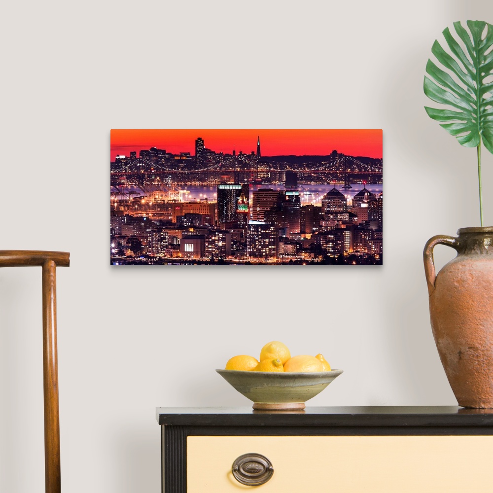 A traditional room featuring A photograph of a vibrant neon lighted cityscape at sunset.
