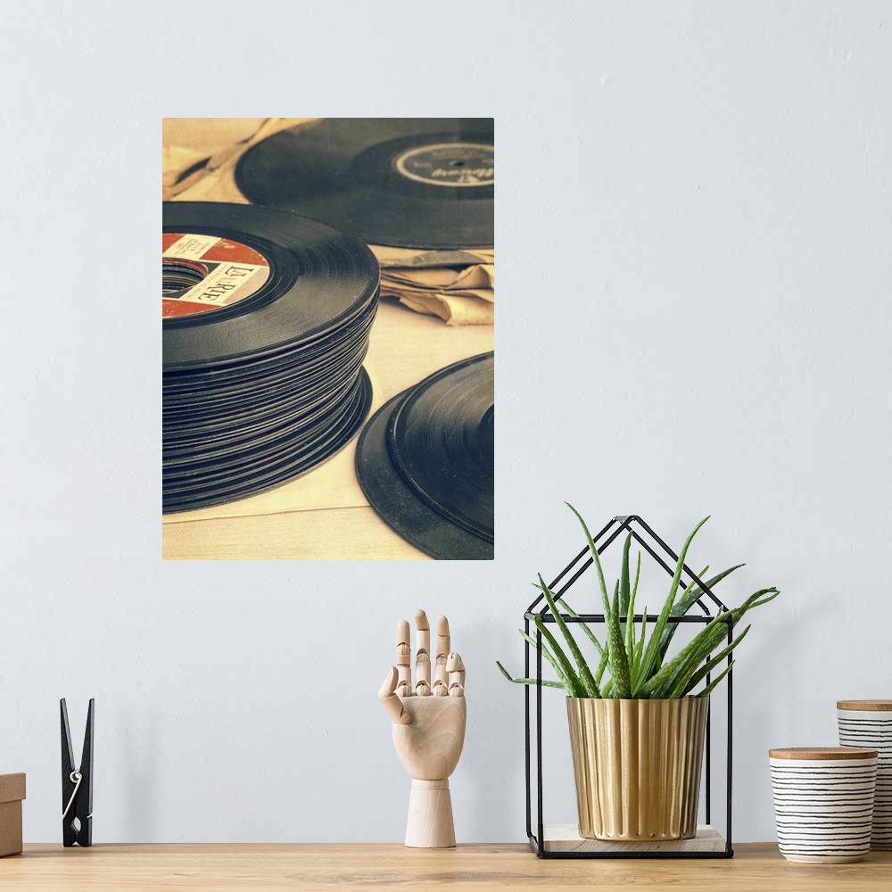 A bohemian room featuring Stacks of old record albums. 33 rpm and 45 rpm.  Still life photography by Edward M. Fielding