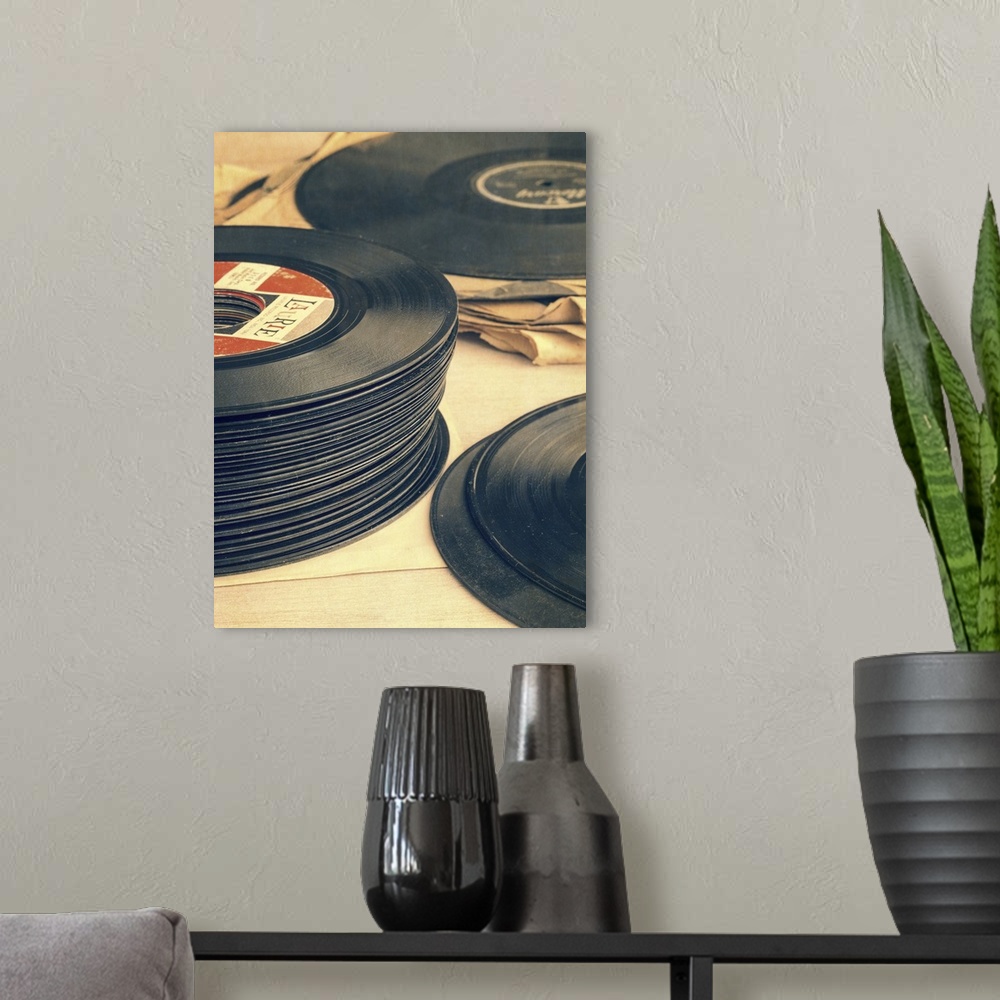 A modern room featuring Stacks of old record albums. 33 rpm and 45 rpm.  Still life photography by Edward M. Fielding
