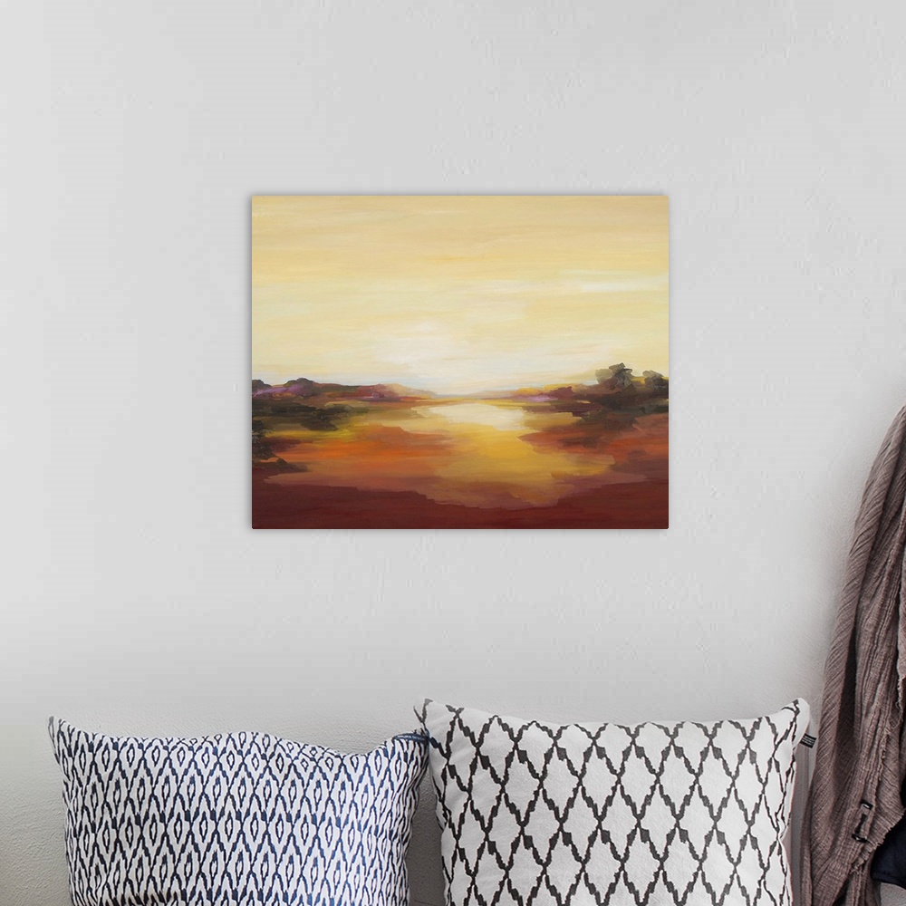 A bohemian room featuring A contemporary abstract painting of a red landscape under a pale yellow sky.
