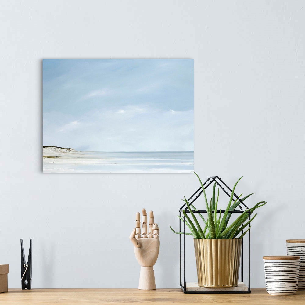 A bohemian room featuring A contemporary painting of a calm beach scene.