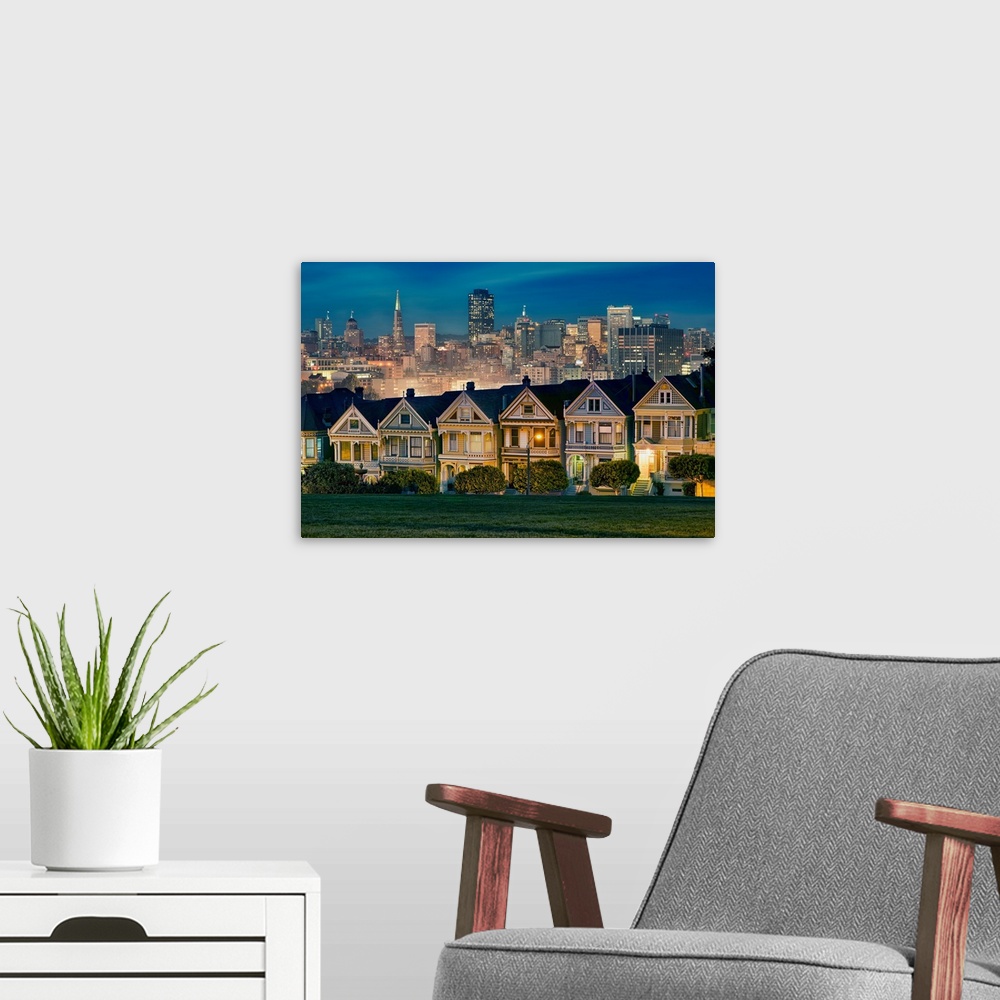 A modern room featuring Photograph of colorful row houses in San Francisco at twilight with the city skyline in the backg...