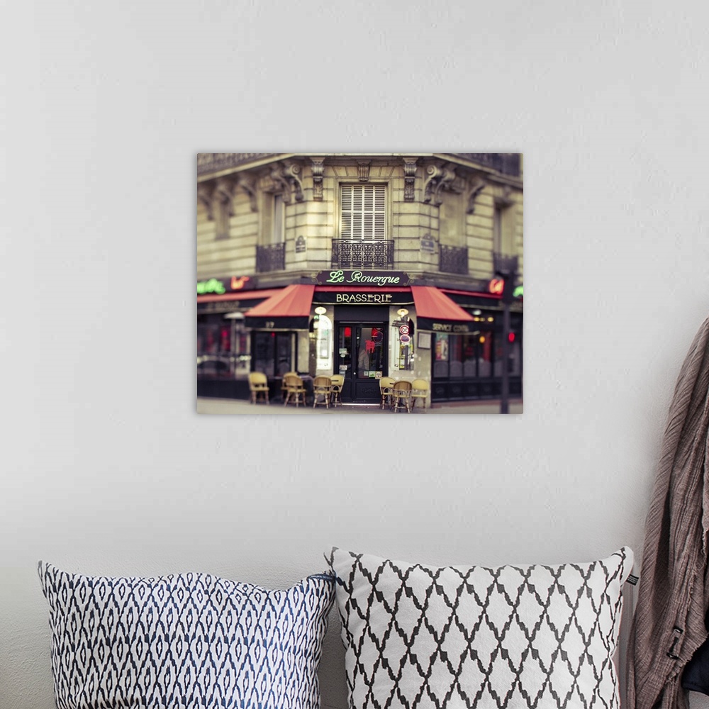 A bohemian room featuring Center focused photograph of a Parisian restaurant.