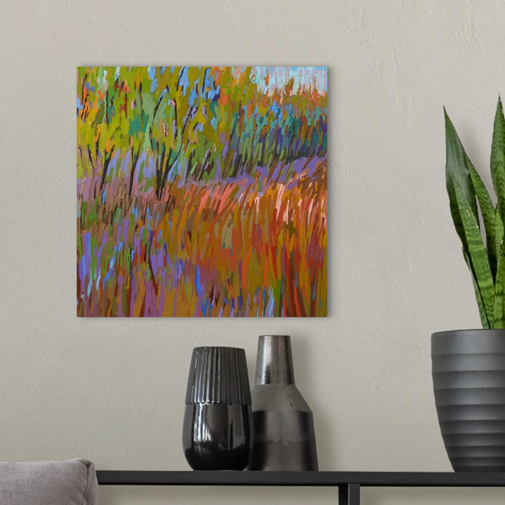 A modern room featuring A square abstract of trees and a field painted with brush strokes of vibrant colors.