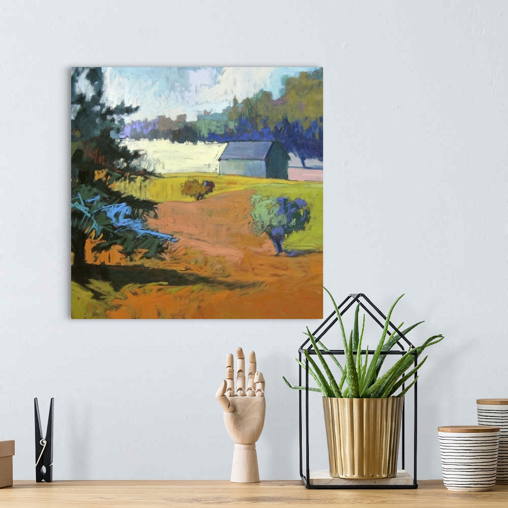 A bohemian room featuring Colorful contemporary landscape painting using deep tones of orange.