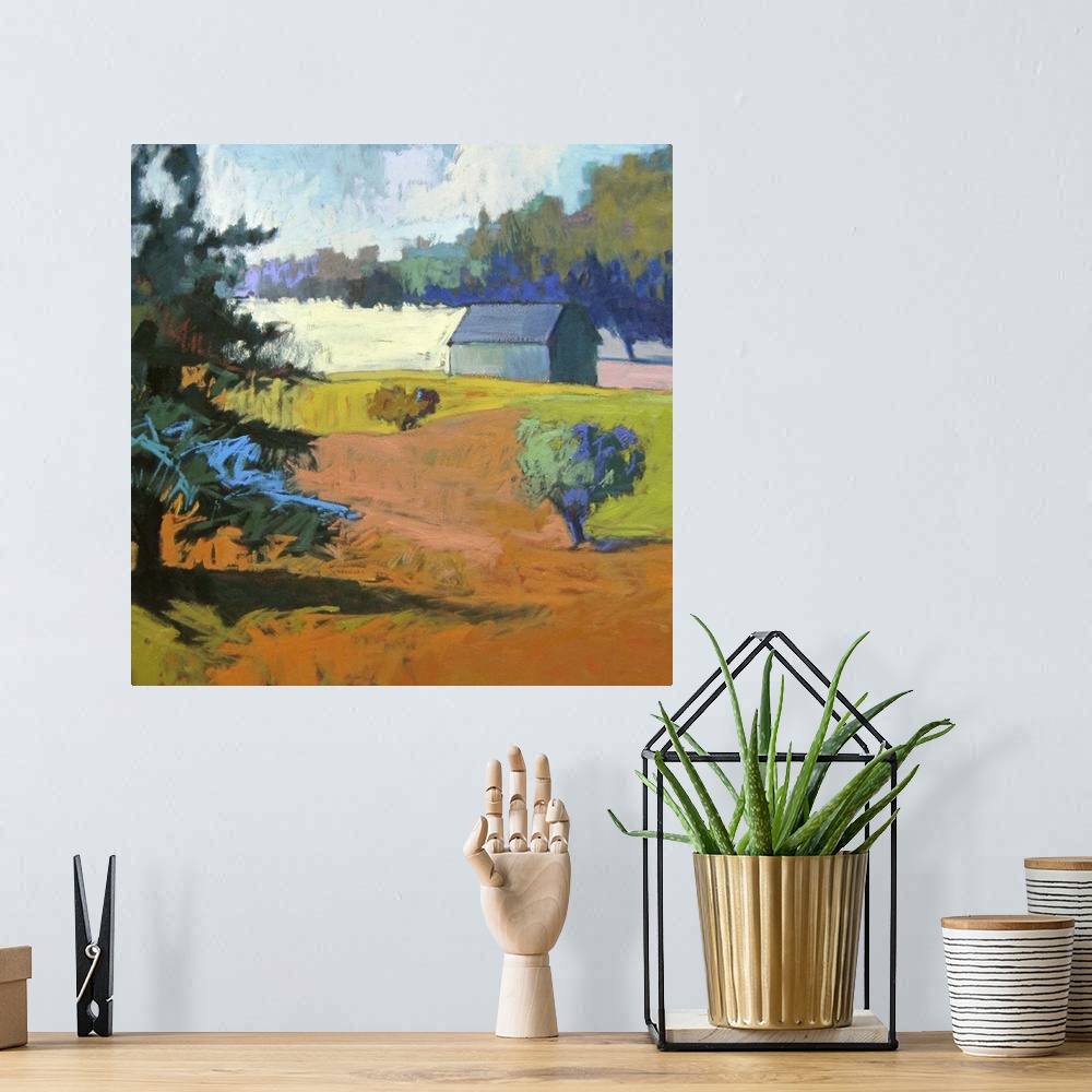 A bohemian room featuring Colorful contemporary landscape painting using deep tones of orange.