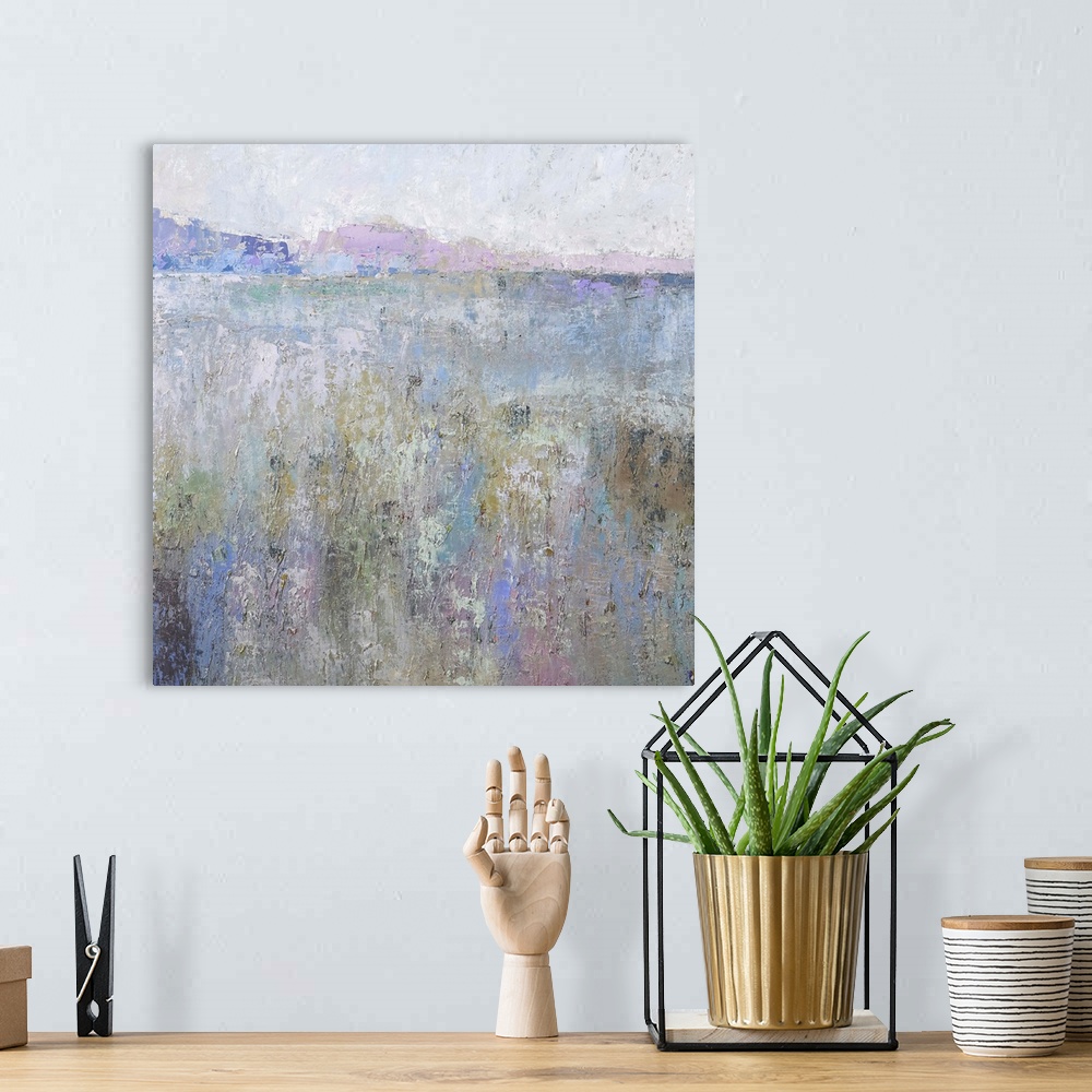 A bohemian room featuring Contemporary landscape painting in pastel colors.