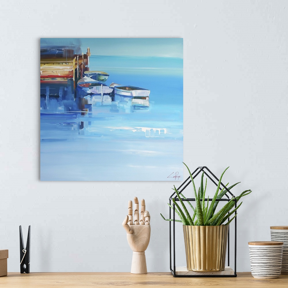 A bohemian room featuring Boats at a wooden dock over deep blue water.