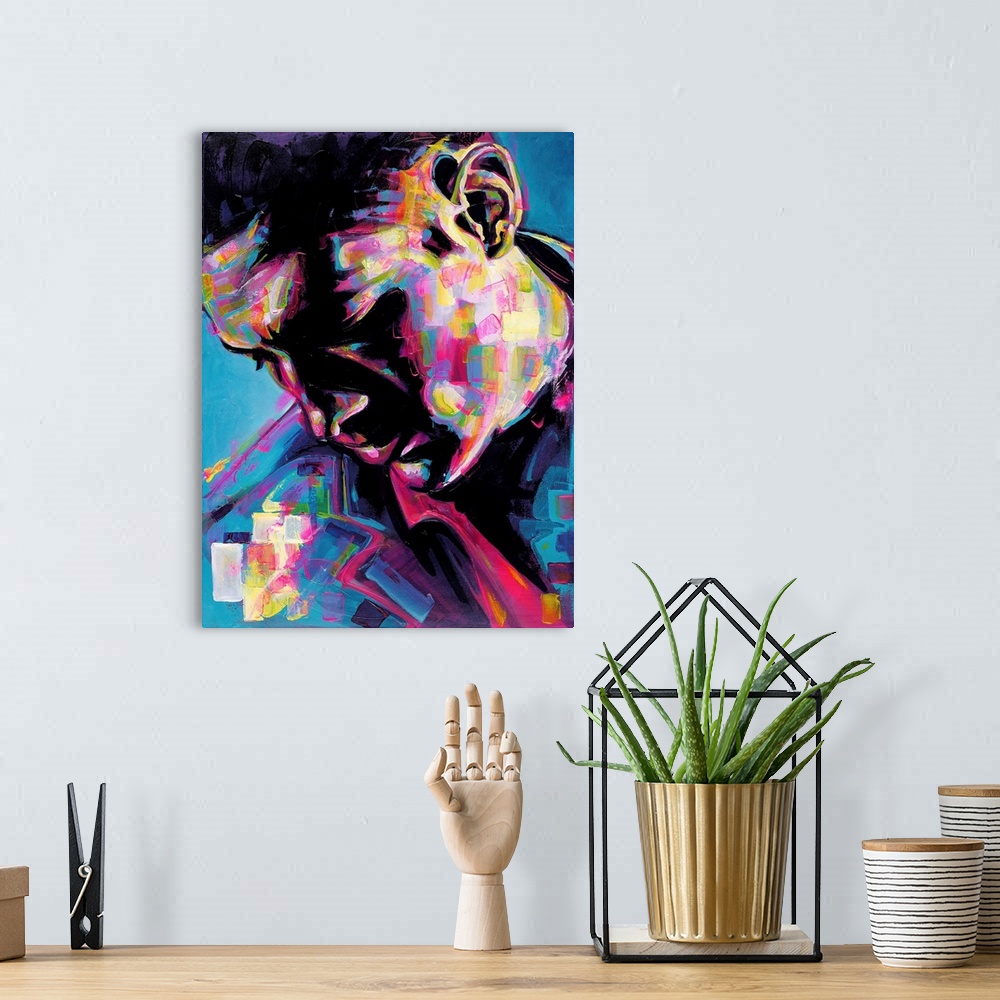 A bohemian room featuring Vertical abstract portrait of a man in vibrant colors.