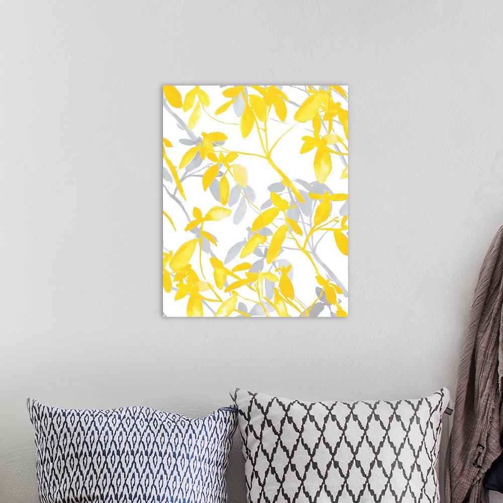 A bohemian room featuring An abstract watercolor painting of branches of leaves in colors of yellow and gray.