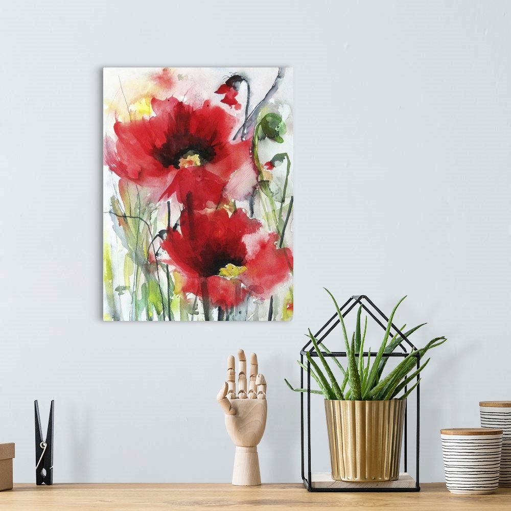 A bohemian room featuring Contemporary watercolor painting of vibrant red flowers.