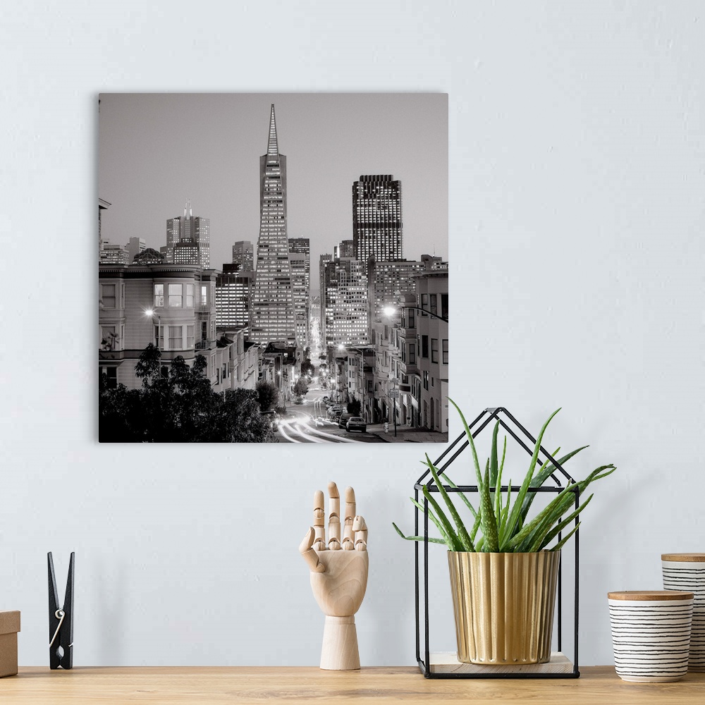 A bohemian room featuring A black and white photograph of the downtown area of San Francisco California.