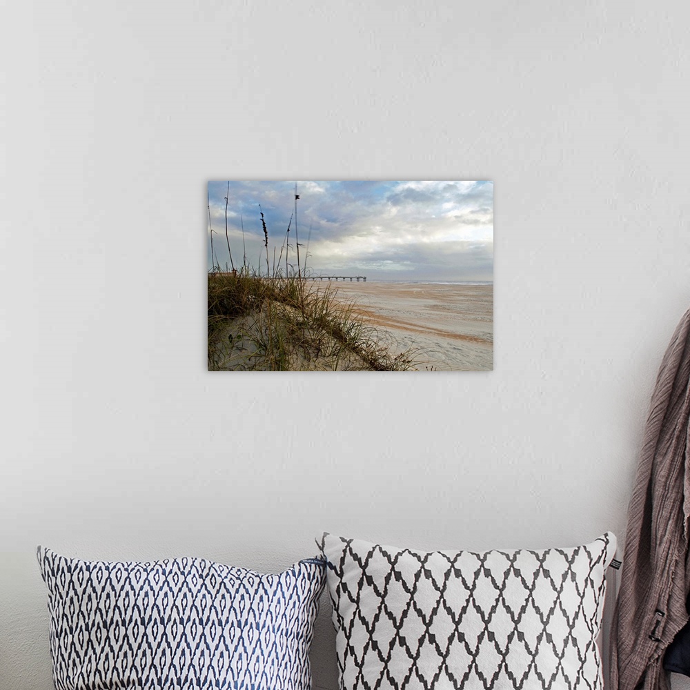 A bohemian room featuring Photograph of an idyllic sandy beach with soft puffy clouds in the sky.