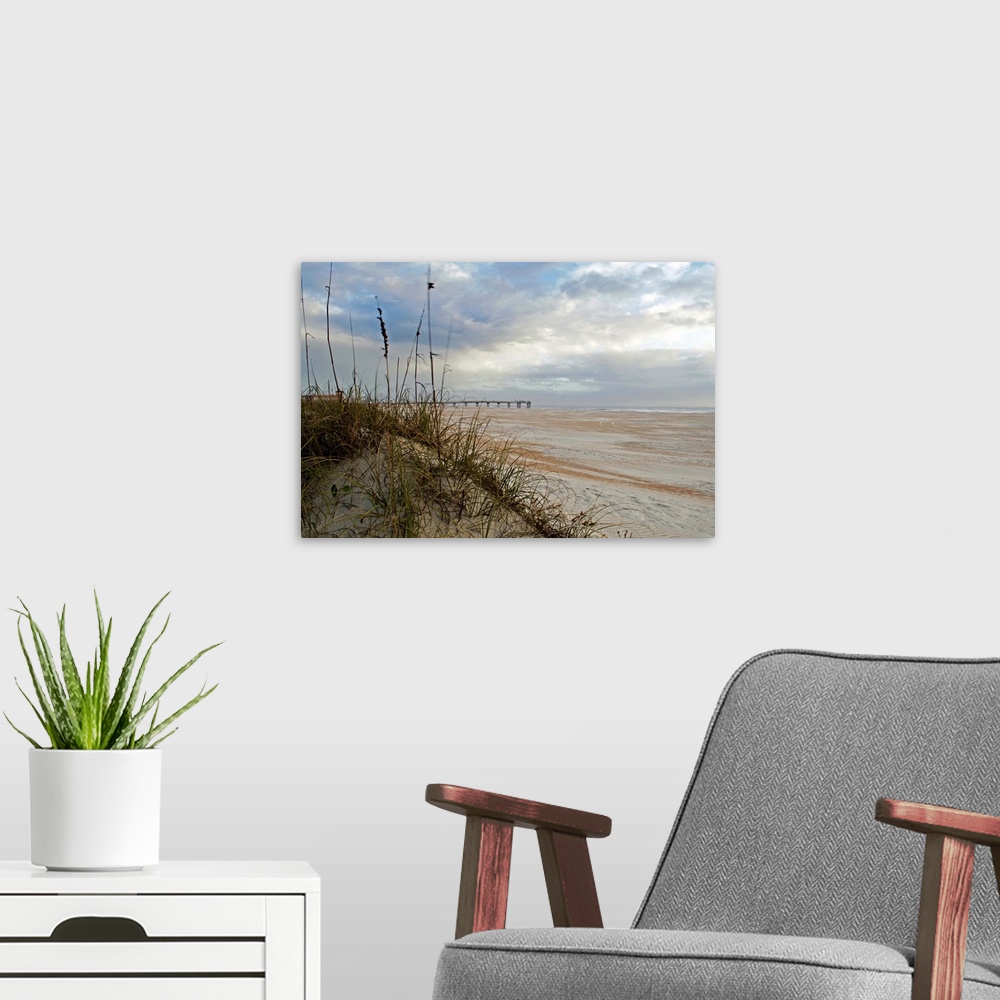 A modern room featuring Photograph of an idyllic sandy beach with soft puffy clouds in the sky.