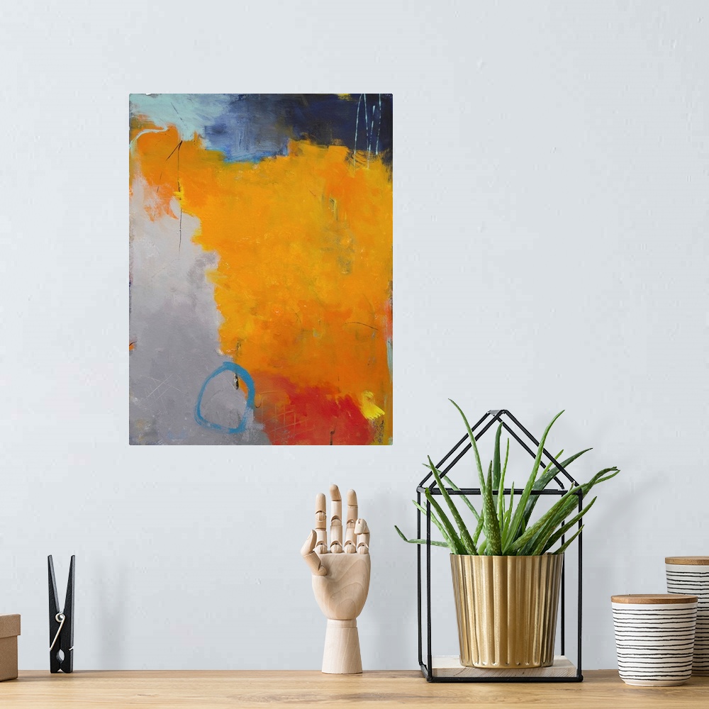 A bohemian room featuring Contemporary abstract painting in brilliant orange hues on a gray background.