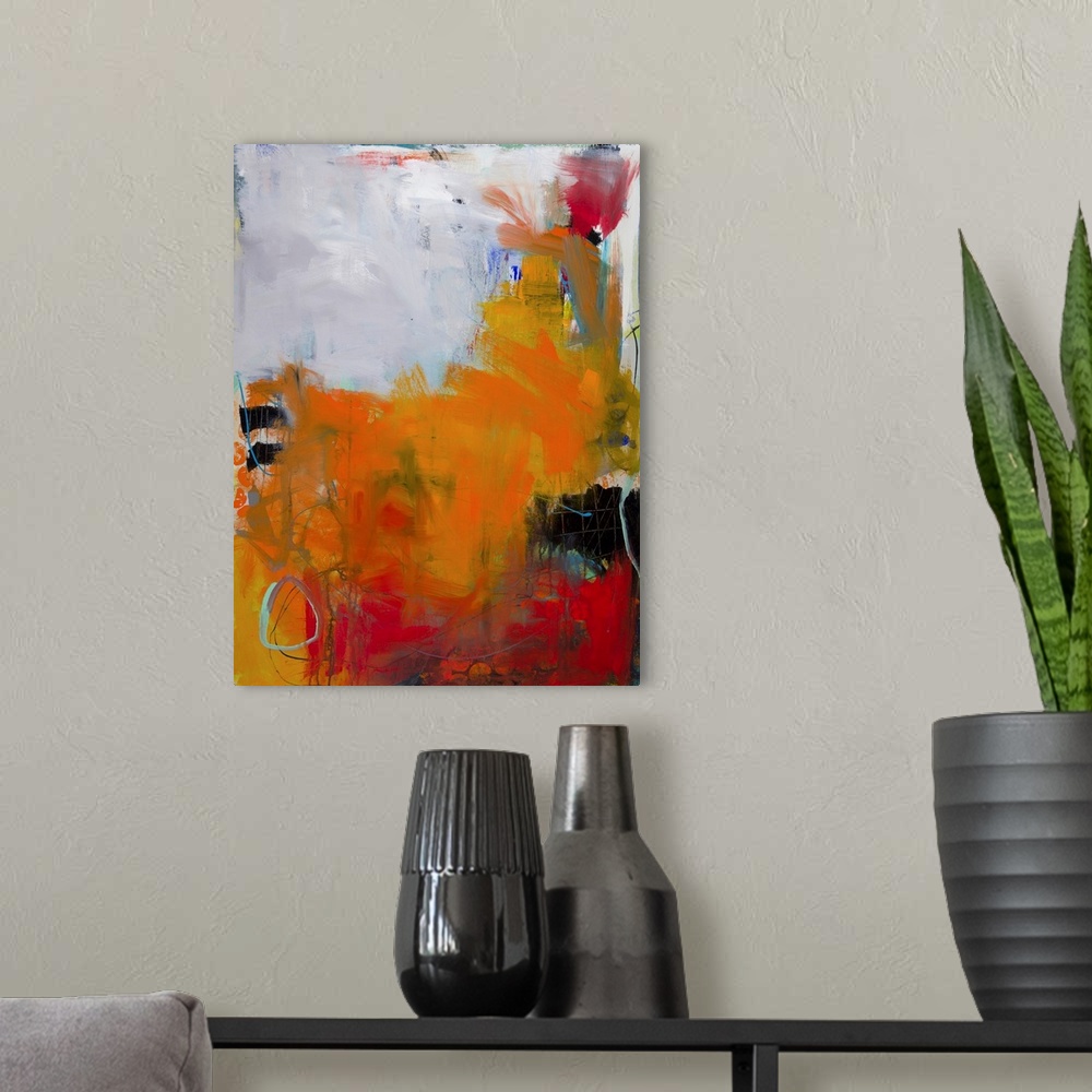 A modern room featuring Contemporary abstract painting in brilliant orange hues on a gray background.