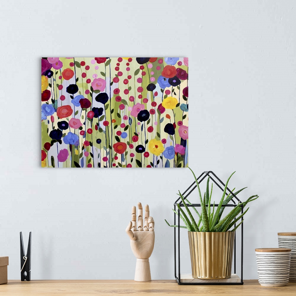 A bohemian room featuring Colorful painting of a garden of bright flowers.