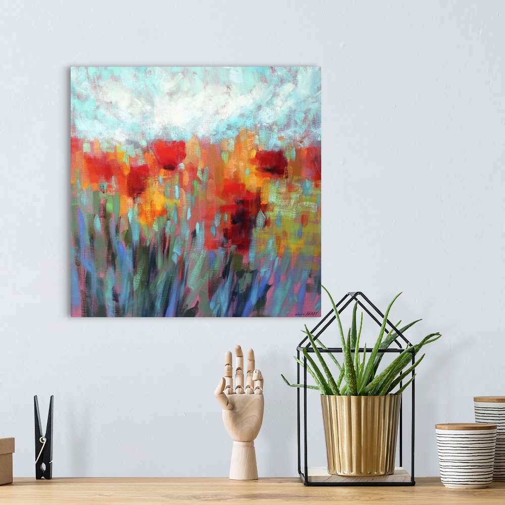A bohemian room featuring A colorful contemporary painting of a field of flowers.