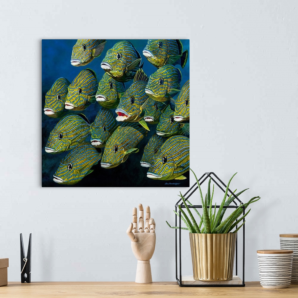A bohemian room featuring A square painting of a shoal of colorful Grunts.