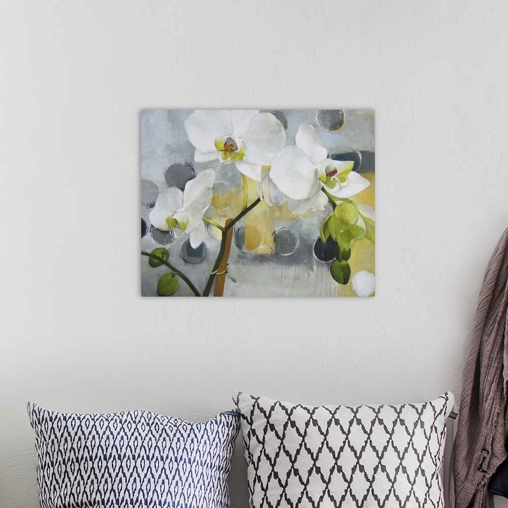 A bohemian room featuring A contemporary painting of white orchids against a gray background with dark gray dots.
