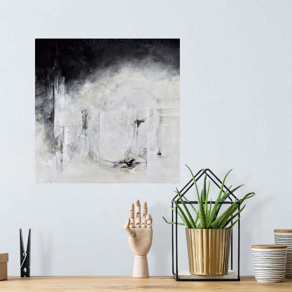 A bohemian room featuring Black and white abstract artwork with a hazy effect.