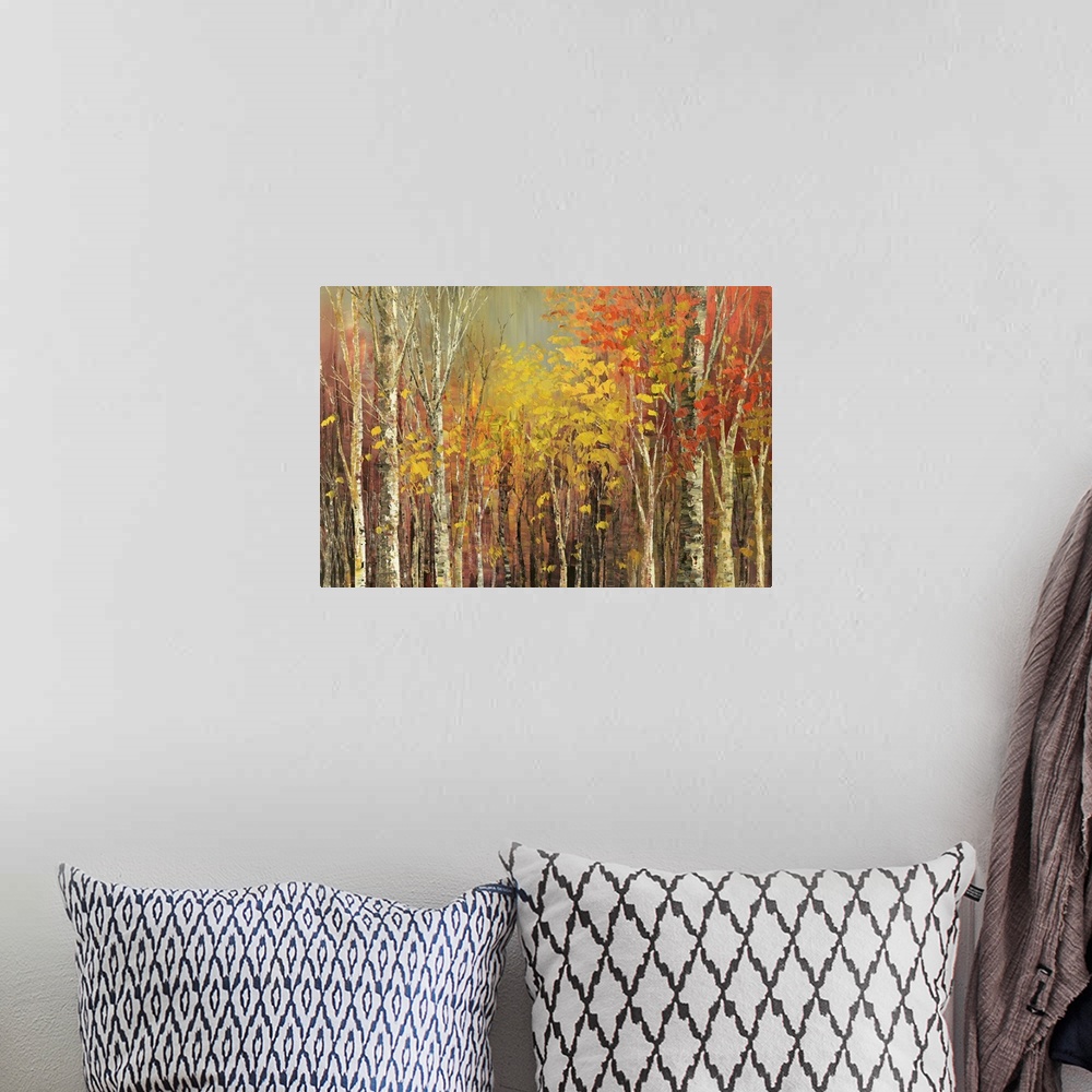 A bohemian room featuring Painting of a grove of trees in bright fall colors.