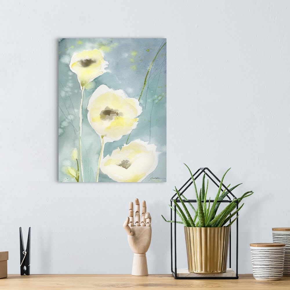 A bohemian room featuring A vertical watercolor painting of delicate yellow flowers against a teal backdrop.