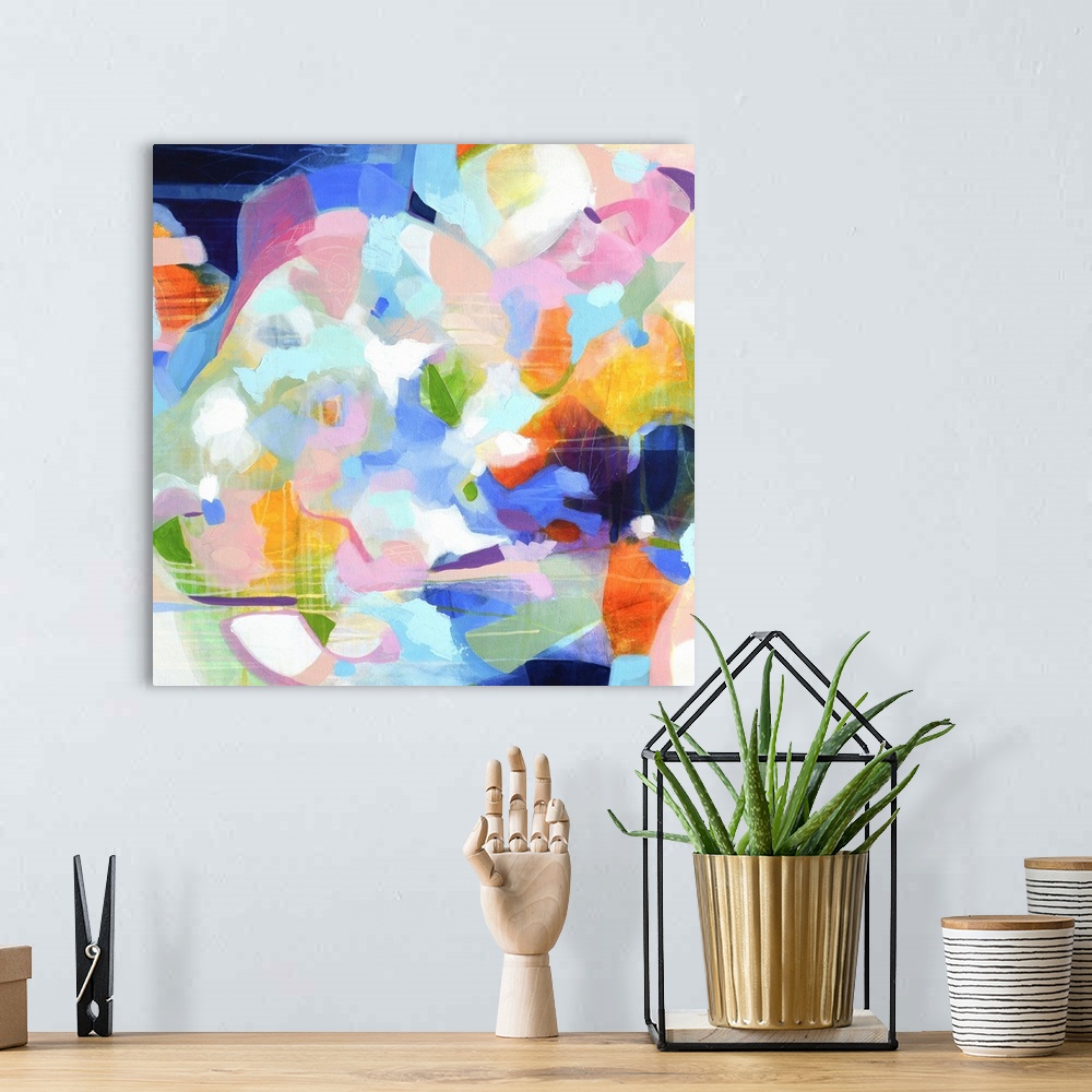 A bohemian room featuring Contemporary abstract artwork in vibrant blue, orange, and pink.