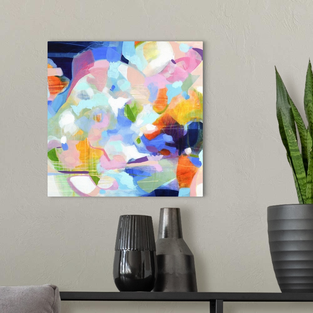 A modern room featuring Contemporary abstract artwork in vibrant blue, orange, and pink.