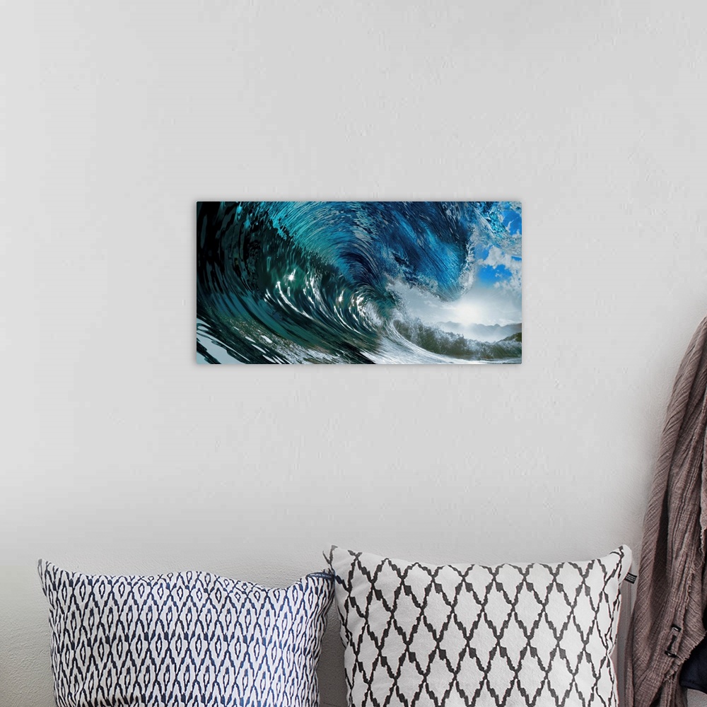A bohemian room featuring Panoramic photo of the inside of a large wave in the ocean before it breaks.