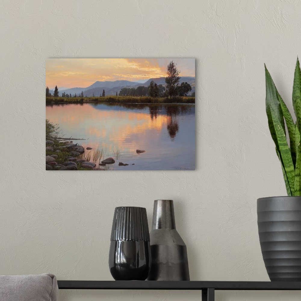 A modern room featuring A contemporary landscape painting of a lake at sunset reflecting the surrounding trees
