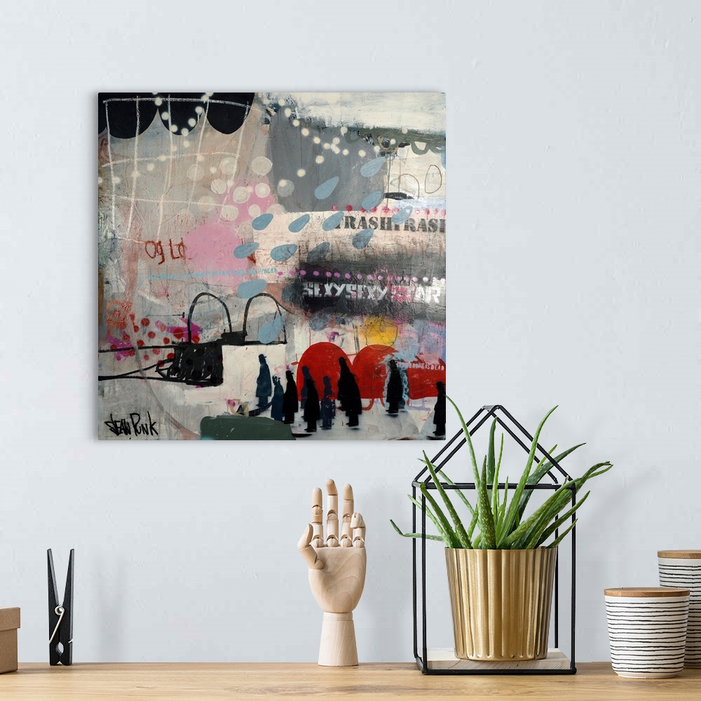 A bohemian room featuring Abstract square collage of text and varies painted shapes.