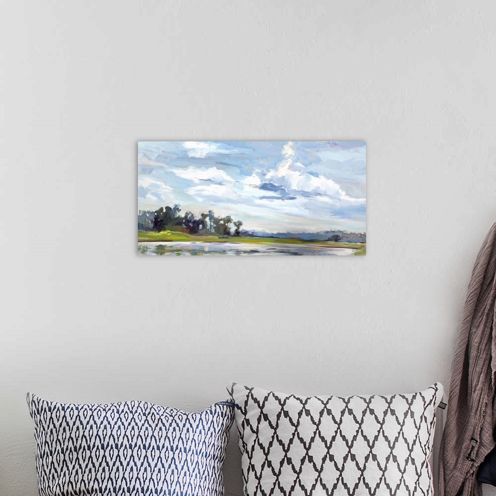 A bohemian room featuring A contemporary painting of a marshland under a blue sky.