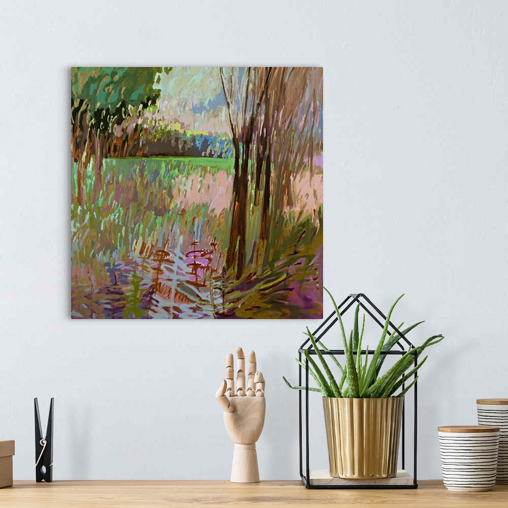 A bohemian room featuring Contemporary landscape painting of a field surrounded by trees.