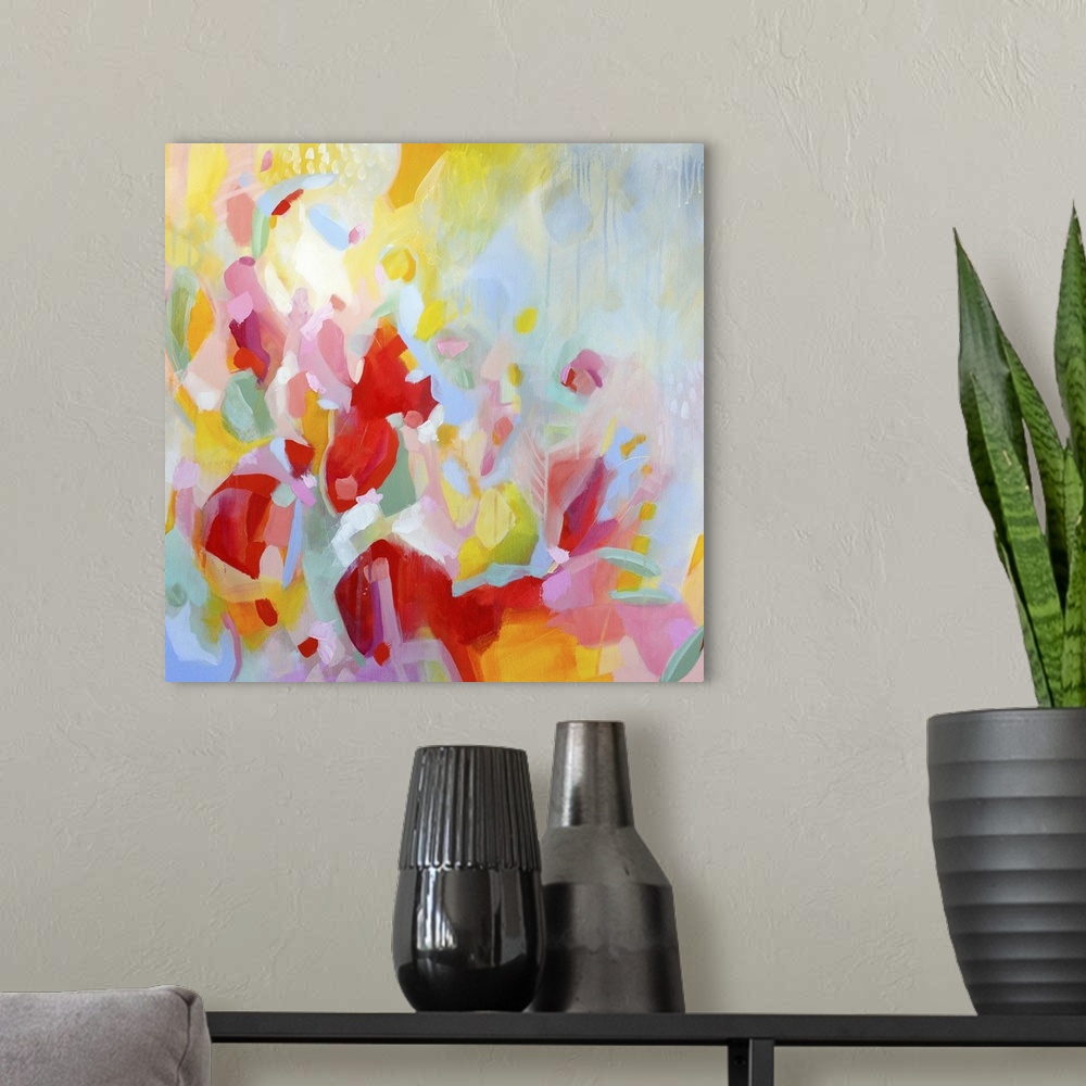A modern room featuring Contemporary abstract artwork in vibrant red, yellow, and pink, resembling a flower garden.