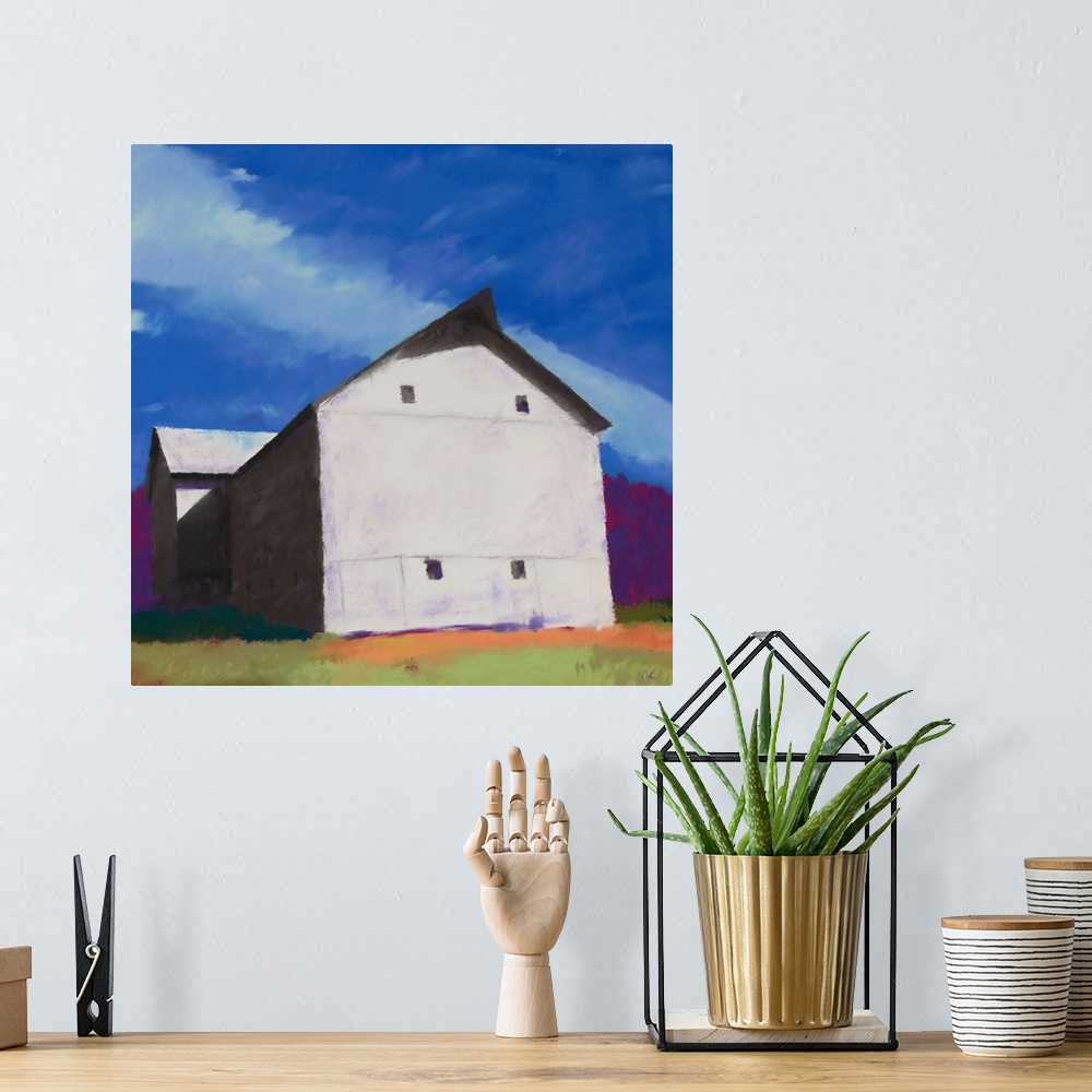 A bohemian room featuring A contemporary painting of a white barn with a brilliant blue sky.
