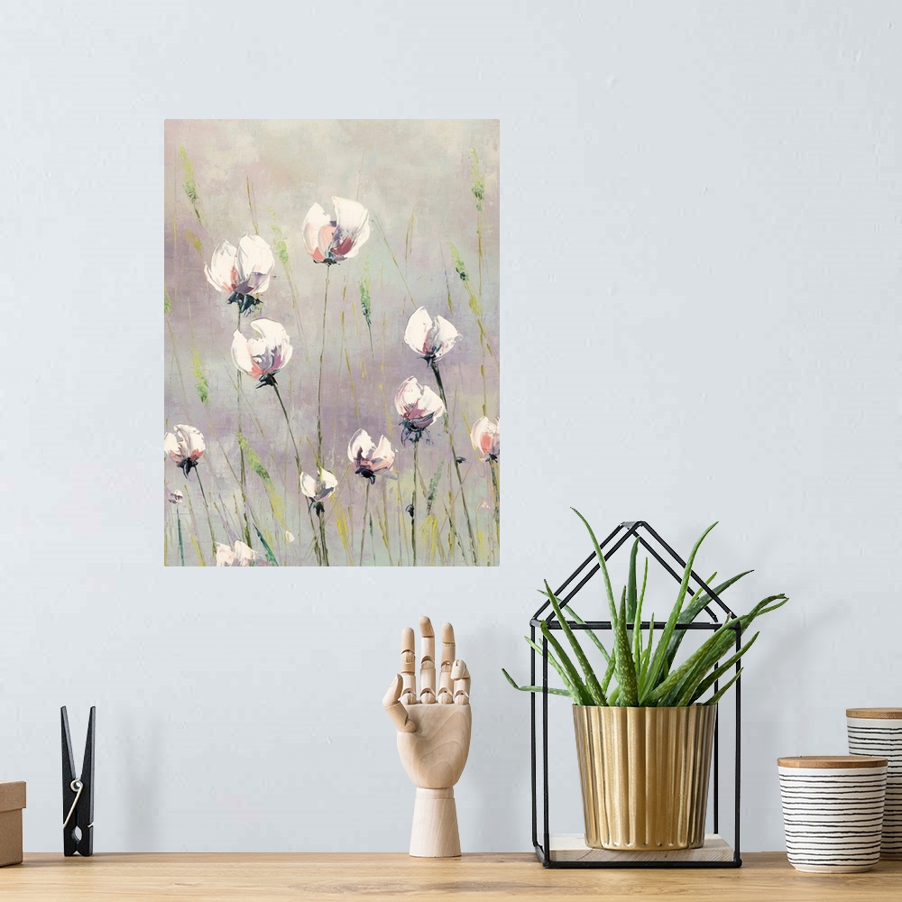 A bohemian room featuring A light, contemporary painting of tall white flowers interspersed with green grasses on a neutral...