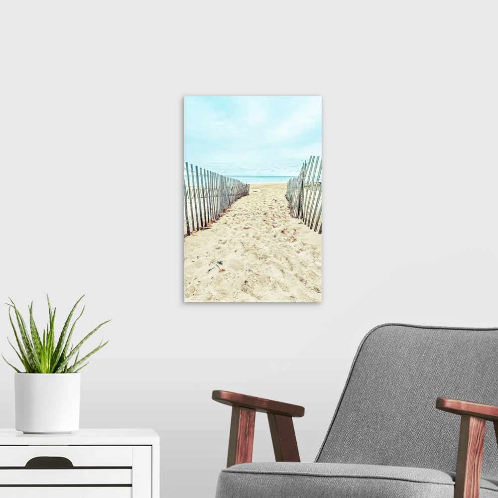 A modern room featuring A sandy path through the dunes to a sandy beach.