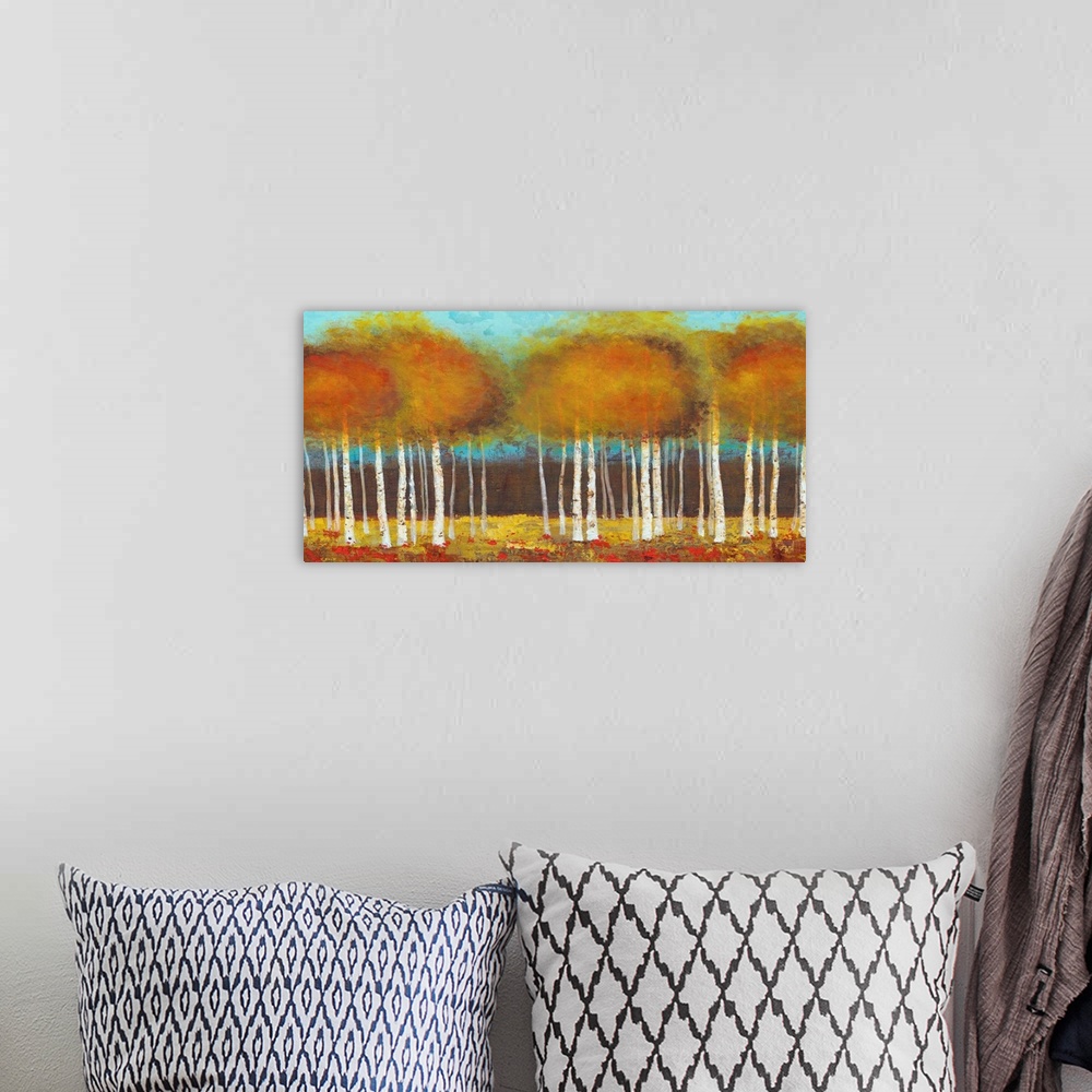 A bohemian room featuring Contemporary painting of brown and orange trees against a teal background sky.