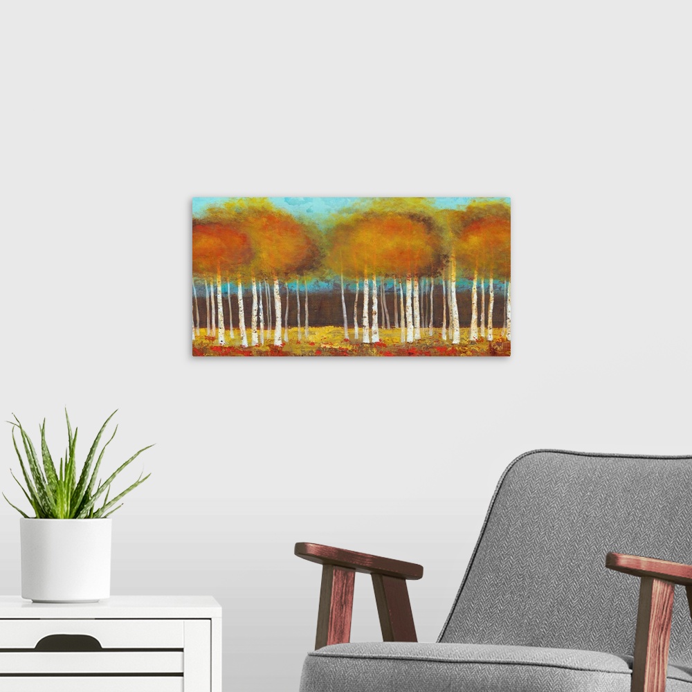 A modern room featuring Contemporary painting of brown and orange trees against a teal background sky.